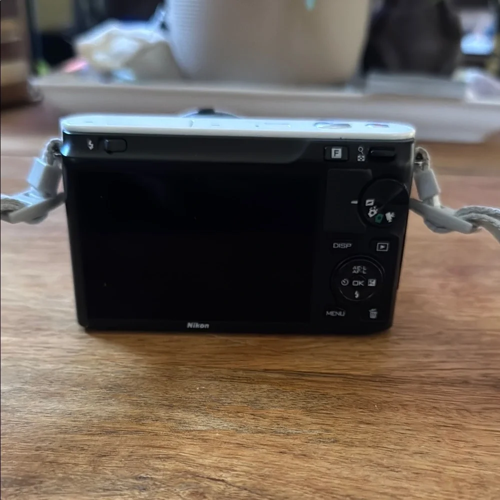 Nikon White Digital Camera with Mirrorless Design and Standard Zoom Lens